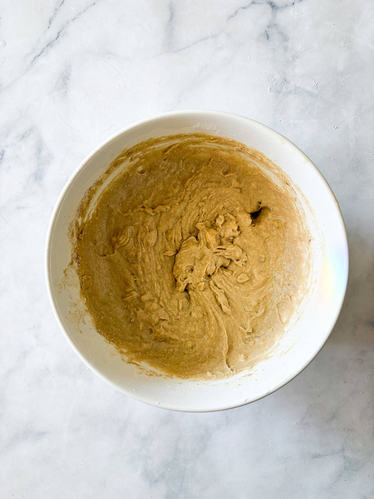 This banana snack cake is fluffy, moist, and balanced by warming spices. Naturally gluten-free, or make it with whole wheat flour. Remaining ingredients are added to the batter for banana snack cake.