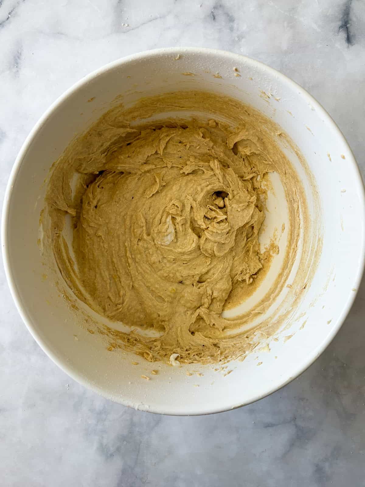 This rich, gluten free banana bundt cake is made with plenty of butter and sugar, then swirled with bananas and chocolate chips. Flours are added to the batter.