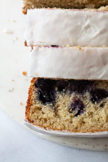 A sliced loaf of gluten free lemon blueberry bread.