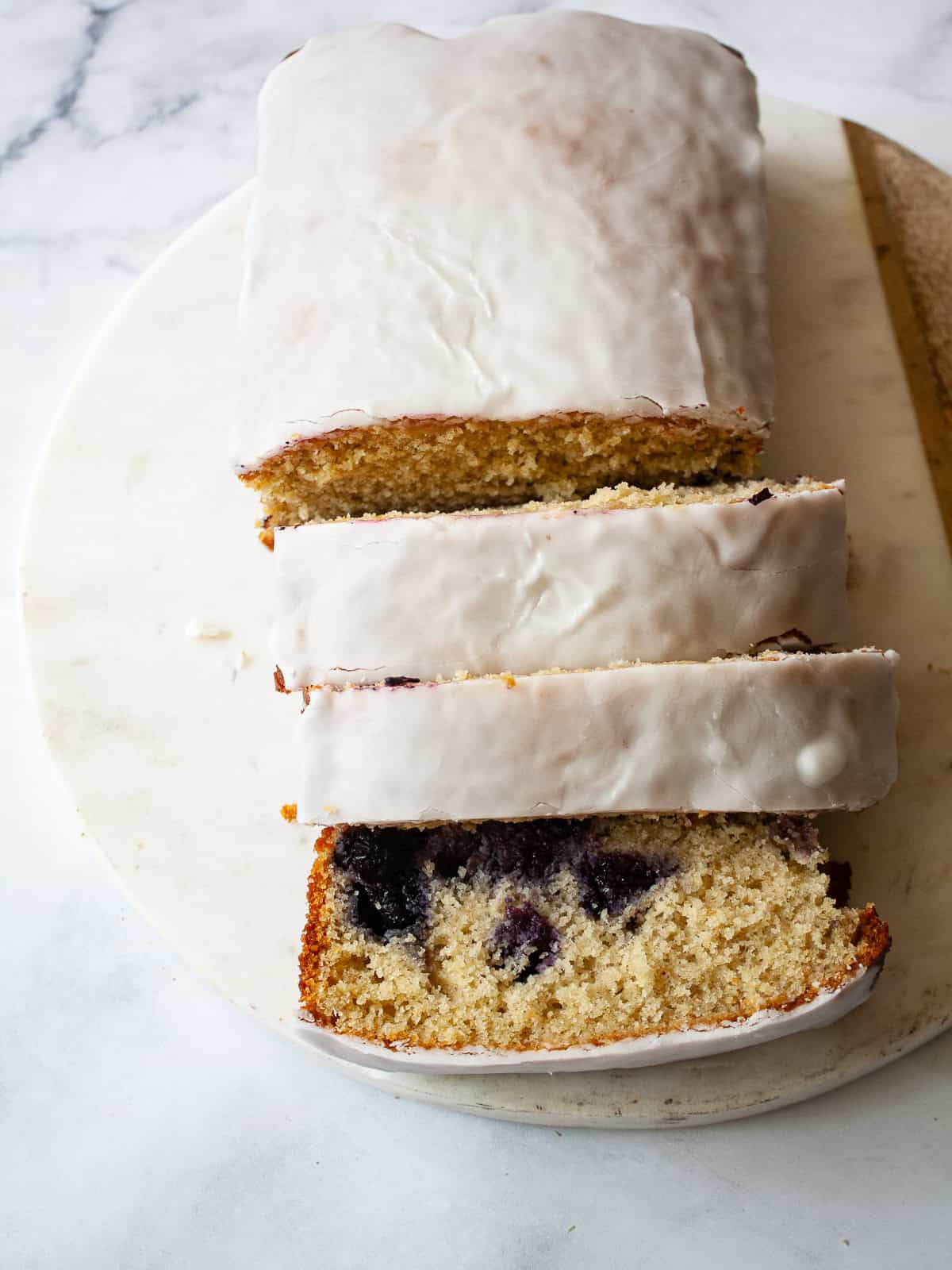 A sliced loaf of gluten free lemon blueberry bread.