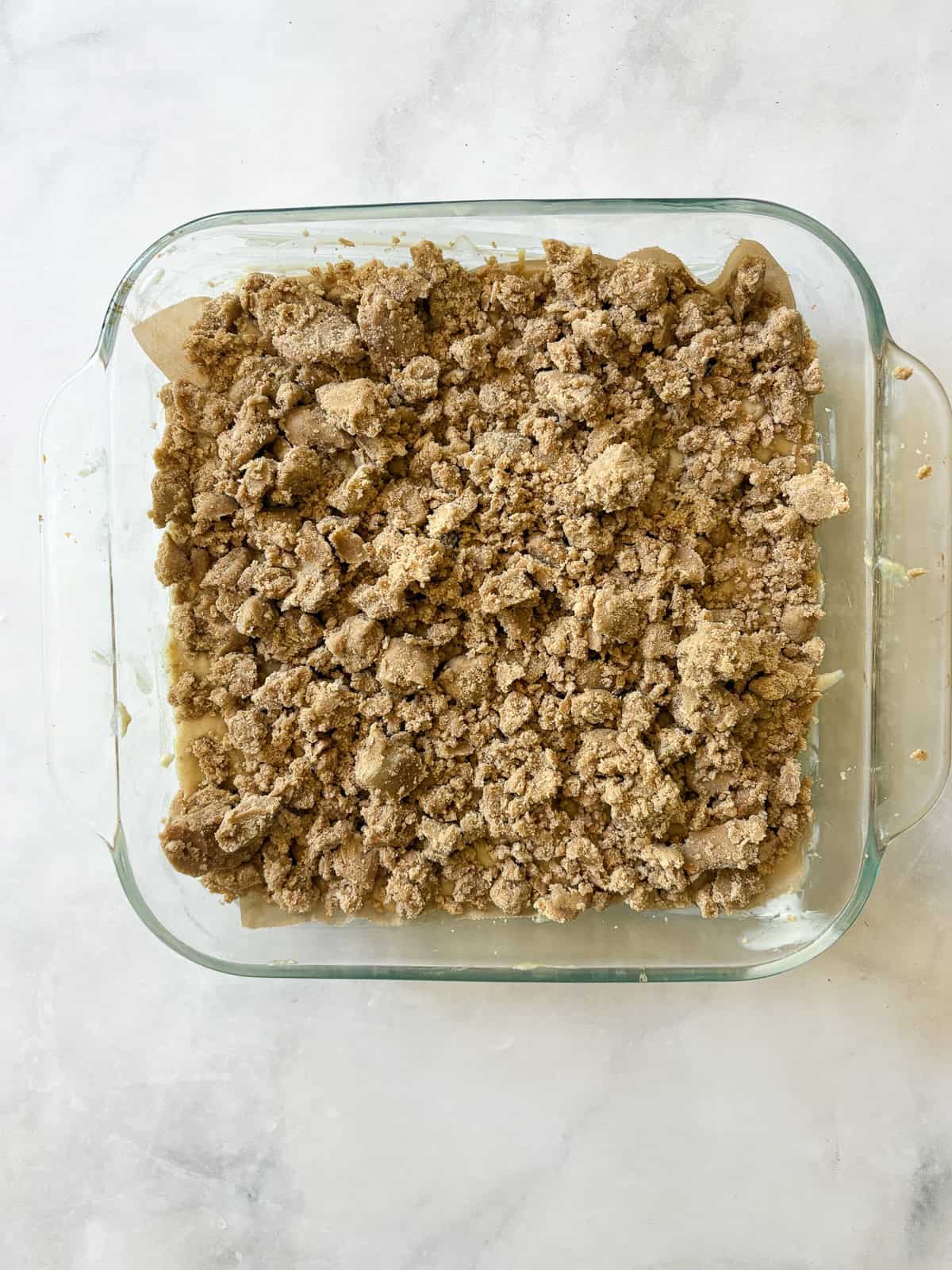 A soft and sweet gluten free rhubarb crumb cake with tart bits of rhubarb and a buttery, brown sugar streusel. Great for brunch! Topping is added to the cake batter.