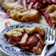A slice of rhubarb galette on a plate.