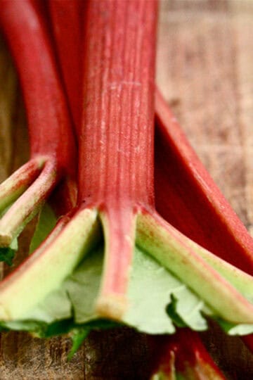 Rhubarb stalks on a cutting board.