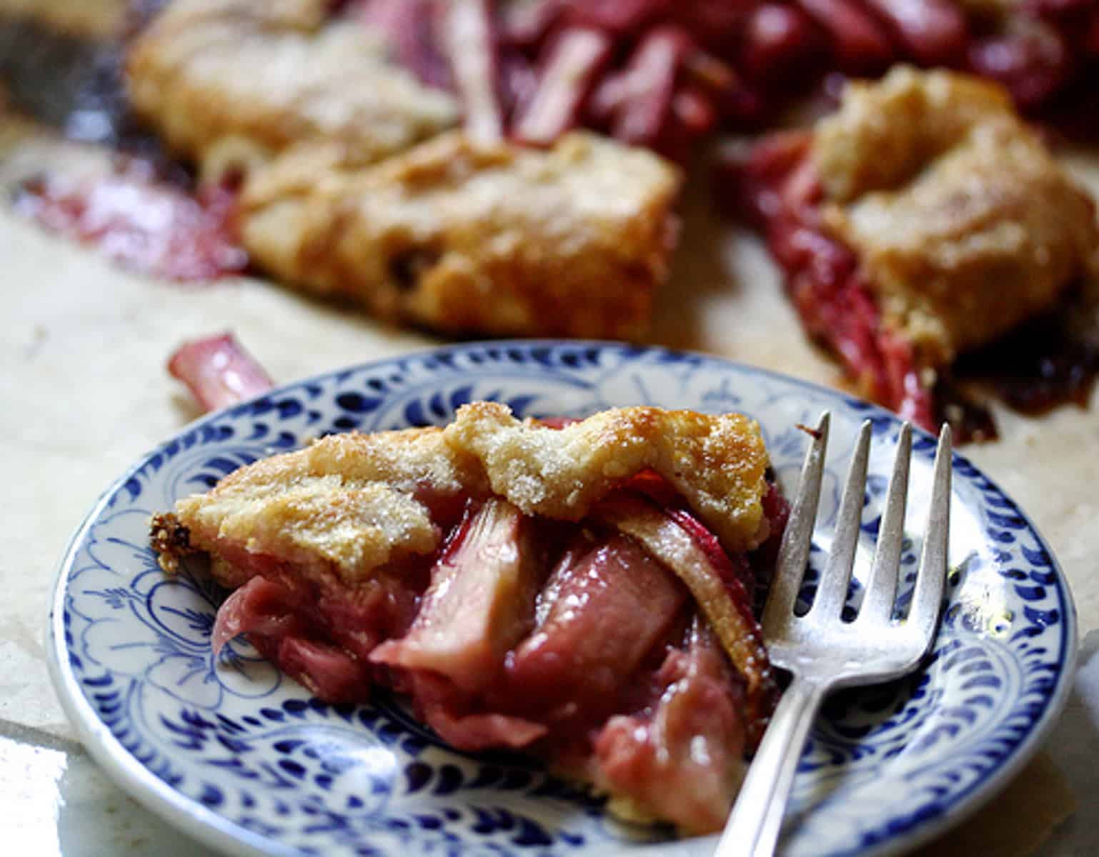 A collection of the best rhubarb recipes, from muffins and scones to cakes, crisps, crumbles, and cocktails. Make the most rhubarb! A piece of rhubarb galette on a plate.