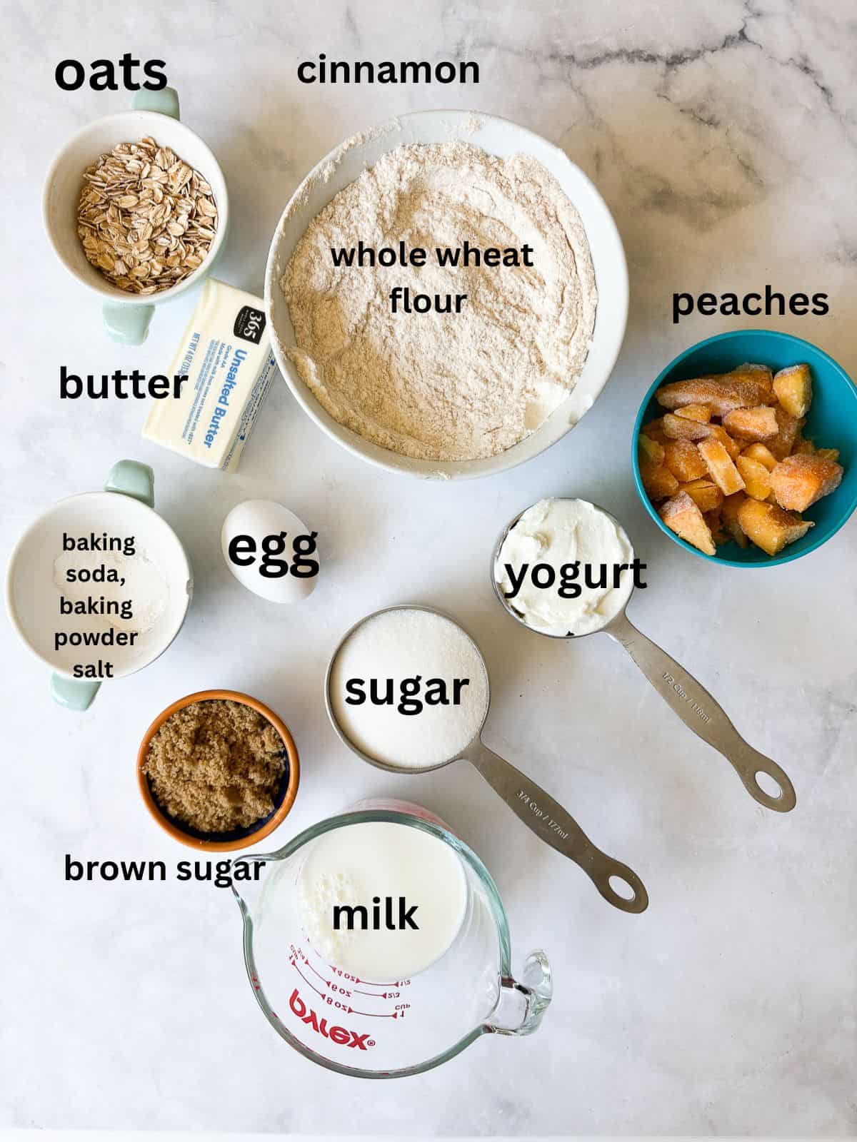 A crisp and cozy oat topping makes this whole grain peach bread shine! Featuring juicy bites of peaches and a brown sugar-cinnamon swirl. Ingredients for whole grain peach bread are text-labeled.