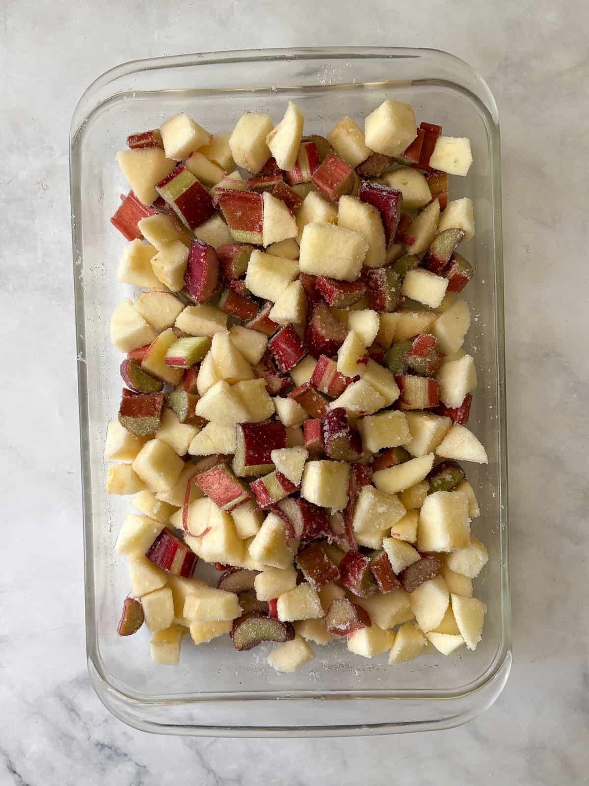 A jammy apple rhubarb crisp pairs seasonal rhubarb with sweet apples. Make the buttery oat topping gluten-free or use whole wheat flour. Chopped apples and rhubarb are mixed together for apple rhubarb crisp.