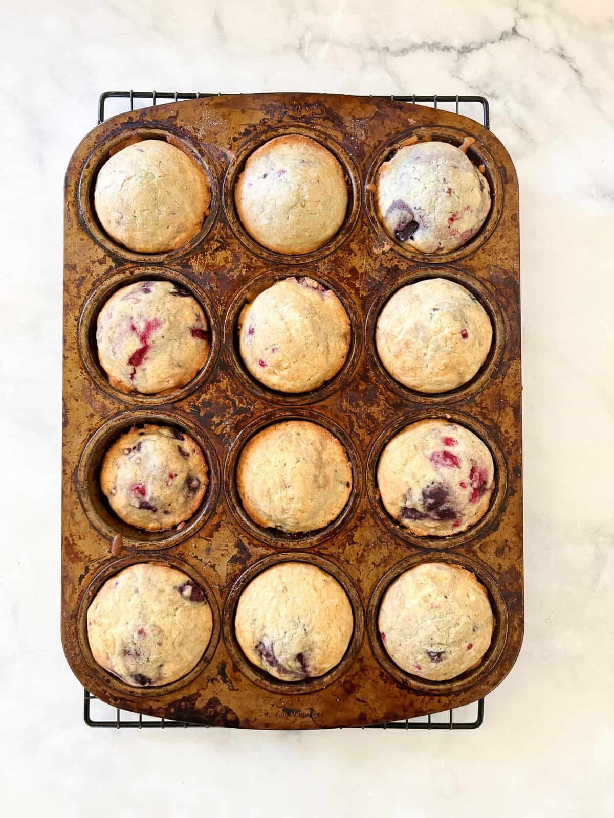 Soft and tender chocolate chip raspberry muffins are made with whole grain flour (easily gluten-free), fruit, and semisweet chocolate!