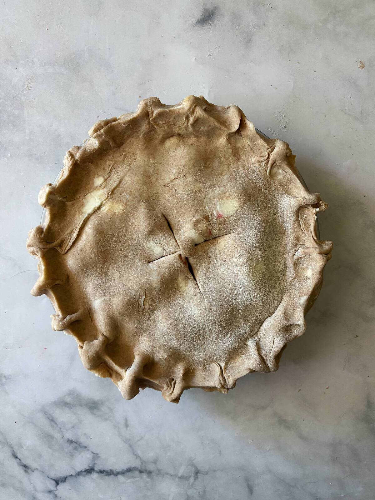 A simple method and ingredients makes this blackberry pie an easy, delicious summer bake. Make gluten-free or not, as needed! The top crust is added to a blackberry pie.