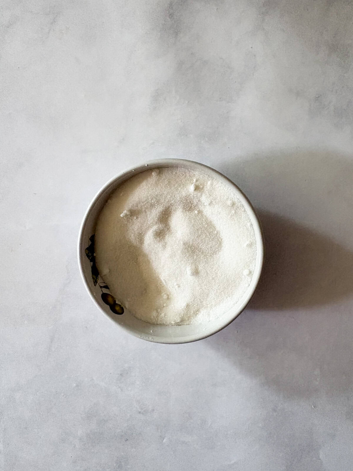 Marshmallowy chocolate chip meringue cookies are studded with mini chocolate chips for bursts of semisweet chocolate in every bite. Cornstarch and sugar mixed in a bowl for chocolate chip meringue cookies.