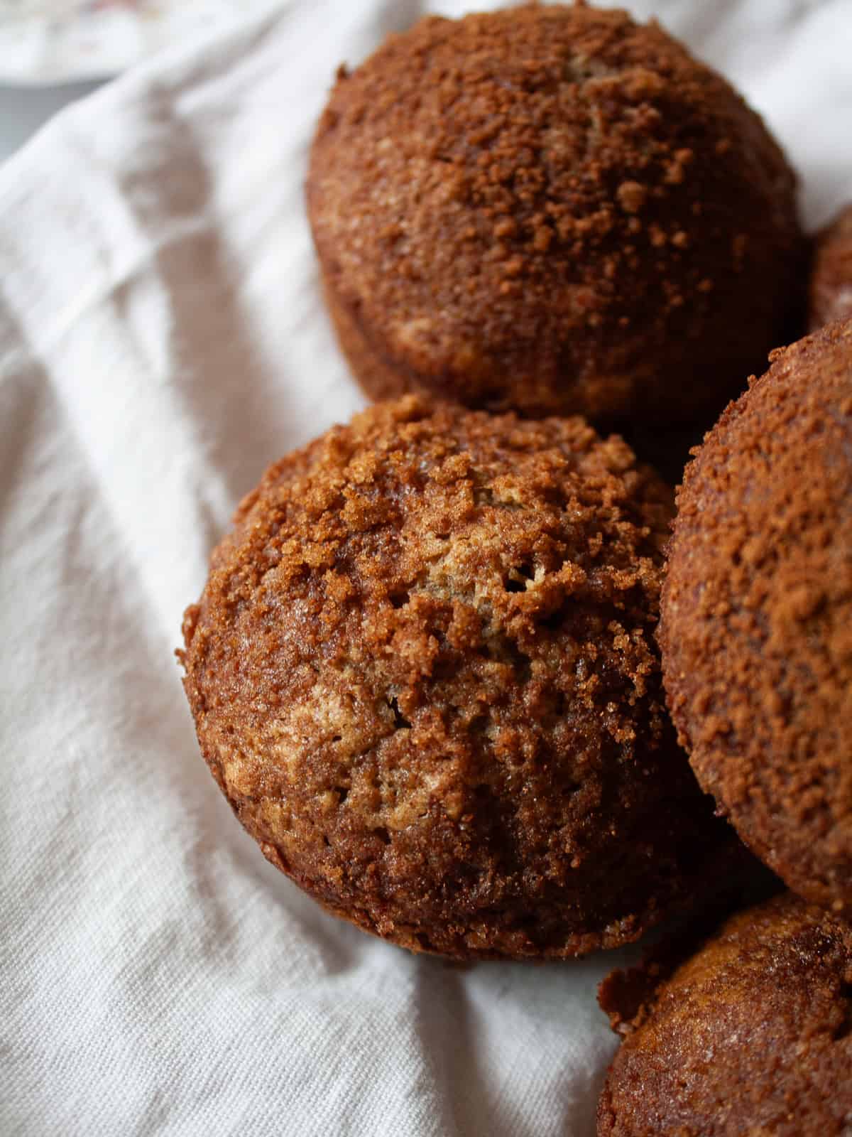 A close up view of cinnamon banana muffins on a plate.