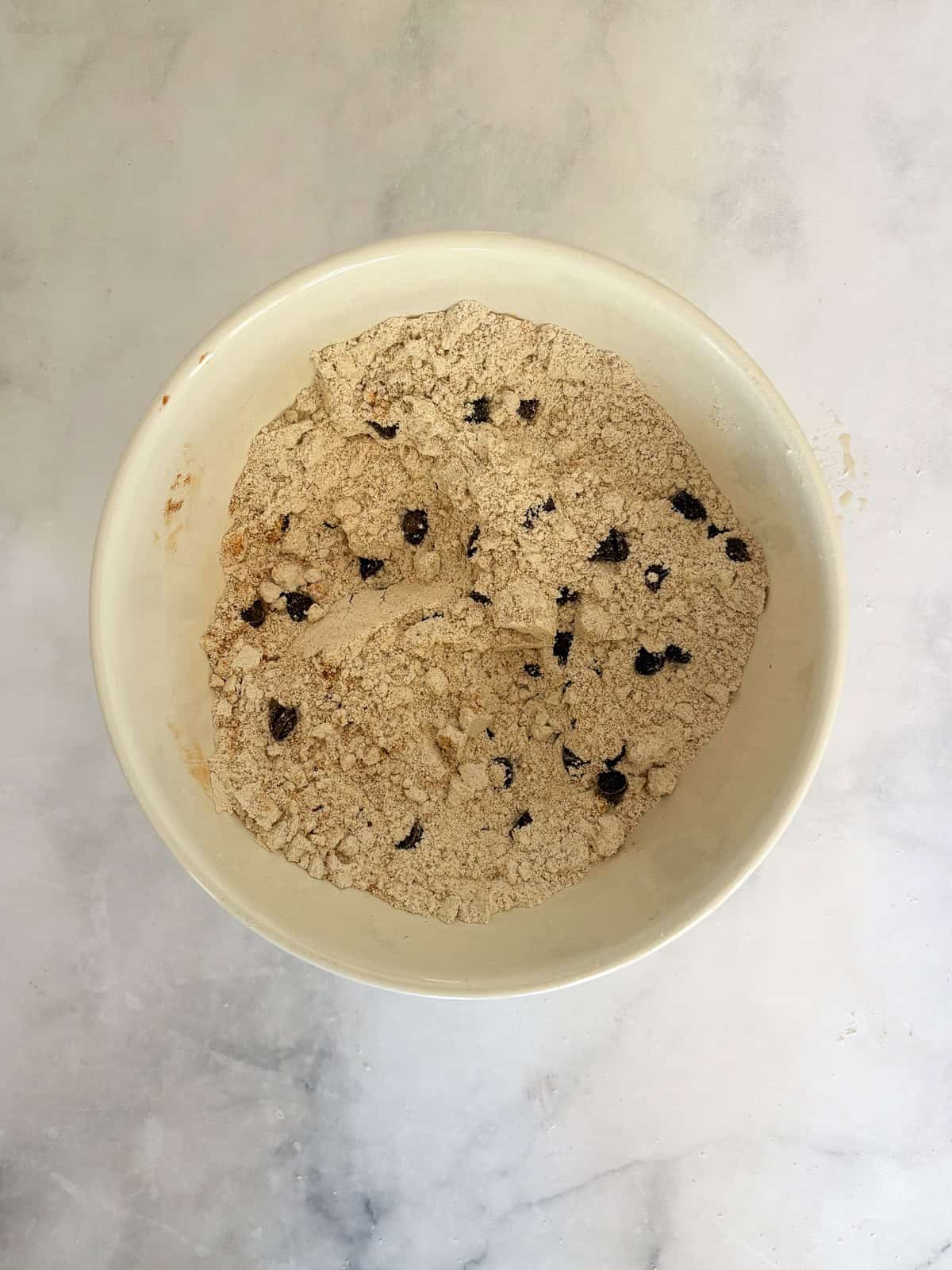 An easy gluten free batter packed with whole grains and yogurt makes for the best loaf of gluten free chocolate chip banana bread. Chocolate chips are mixed with flours for gluten free chocolate chip banana bread.