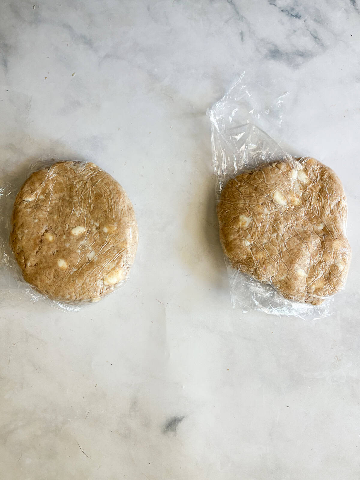 Whole grain flour adds nutrition and flavor to this flaky whole wheat pie crust. Use it in your favorite pies, galettes, and more. Two discs of whole wheat pie crust wrapped in plastic.