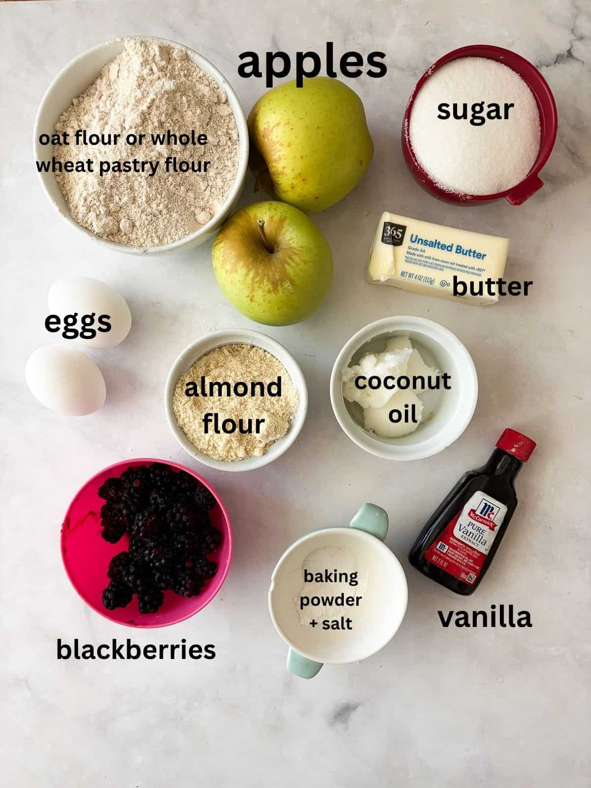 A simple and sweet blackberry apple cake that comes together in one bowl and can be made with g-f oat flour or whole wheat pastry flour. Ingredients for blackberry apple cake are text-labeled.