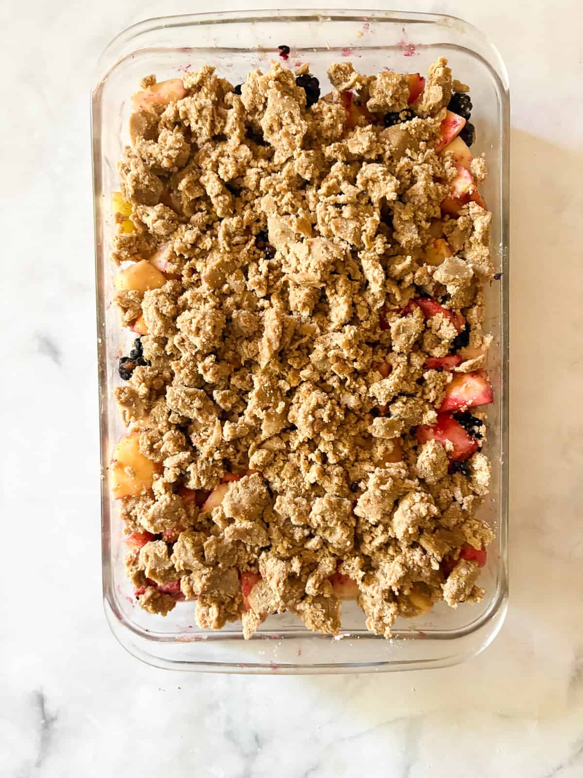 This delicious apple blackberry crumble stars juicy pockets of berries, sweet-tart apples, cinnamon, brown sugar, and a buttery topping. Crumble topping added to blackberry and apple crumble filling.