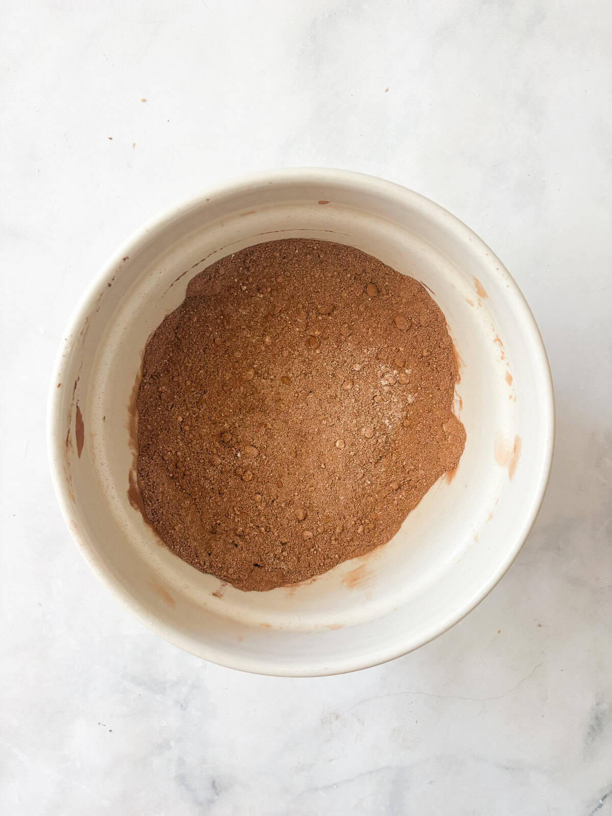 This rich, double chocolate banana bread can be made gluten free or with whole wheat flour for a dense, moist, and utterly delectable loaf. Dry ingredients are mixed together for double chocolate banana bread.