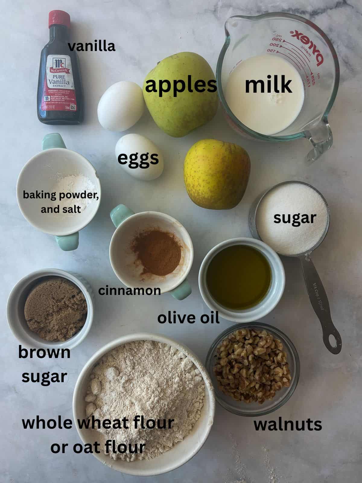 This easy apple walnut bread is tender and filled with fresh apples and crunchy walnuts. Make it with whole wheat flour or oat flour. Ingredients for apple walnut bread are text-labeled.
