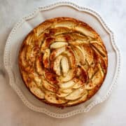 An almond flour apple cake on a plate.