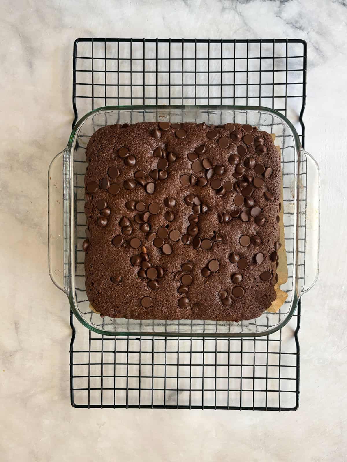 This irresistible one bowl almond flour chocolate cake is wonderfully fluffy and rich, and you need just one simple flour to make it. An almond flour chocolate cake cools in the pan on a rack.