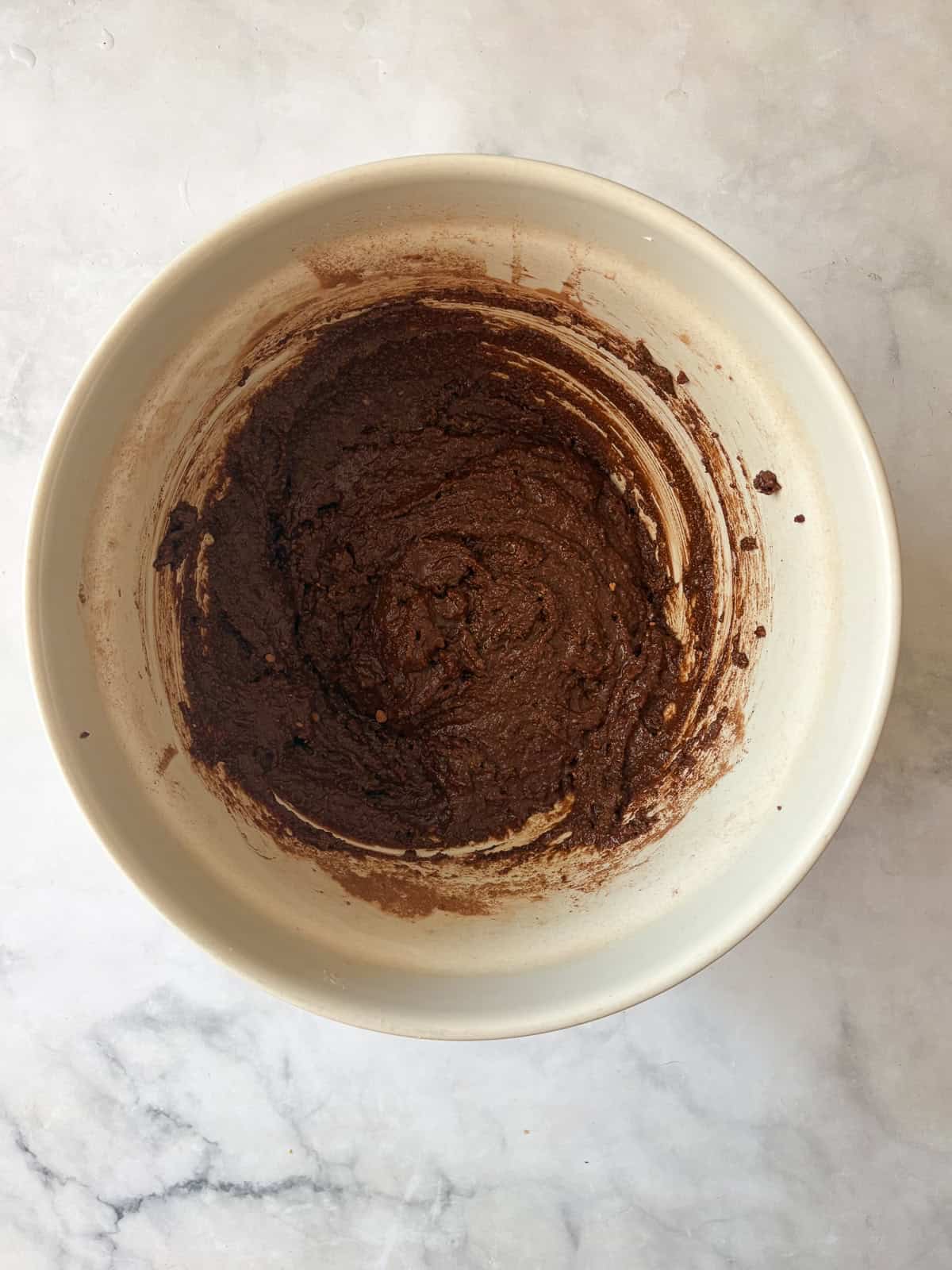 This irresistible one bowl almond flour chocolate cake is wonderfully fluffy and rich, and you need just one simple flour to make it. Almond flour chocolate cake batter in a bowl.