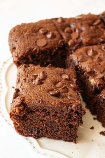 A side view of a slice of almond flour chocolate cake.