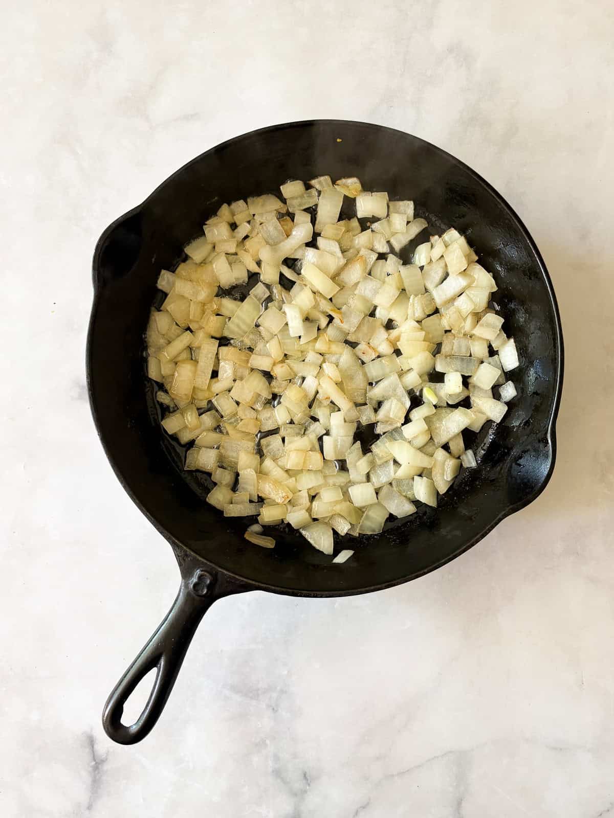 This easy chard gratin is a naturally gluten-free, vegetarian side dish made with fresh chard, onion, cheese, and milk. Perfect for fall and winter. Sautee onion in butter until soft.