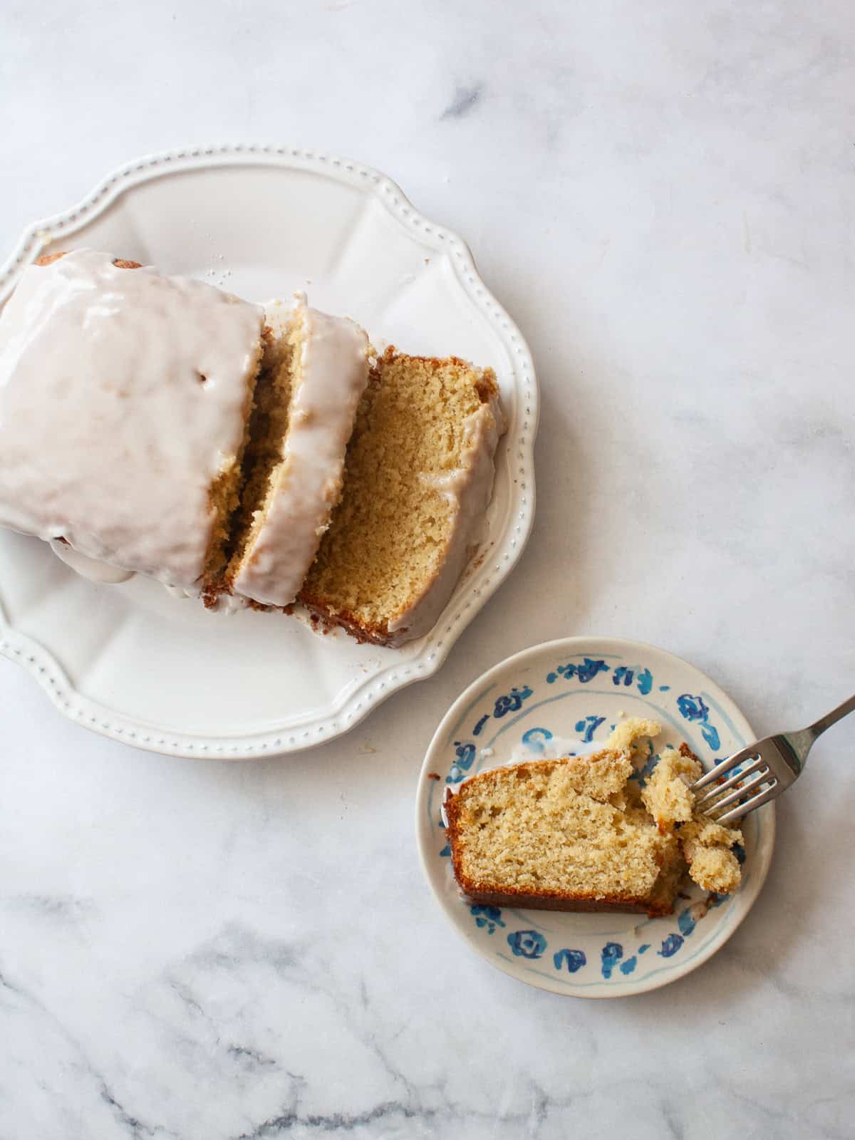 A sweet, lightly pink grapefruit glaze that is so lovely on loaf cakes, regular cakes, cookies, and anywhere else you need a flavor boost! Grapefruit glaze adorns the top of a loaf cake.