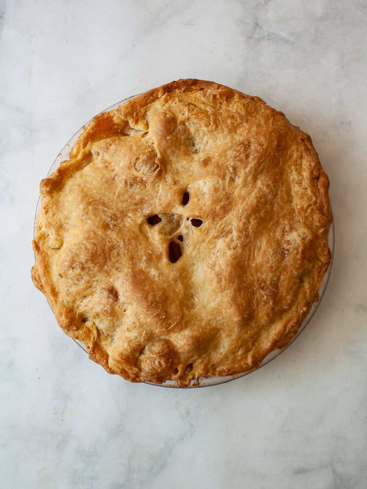 A baked Gravenstein apple pie.