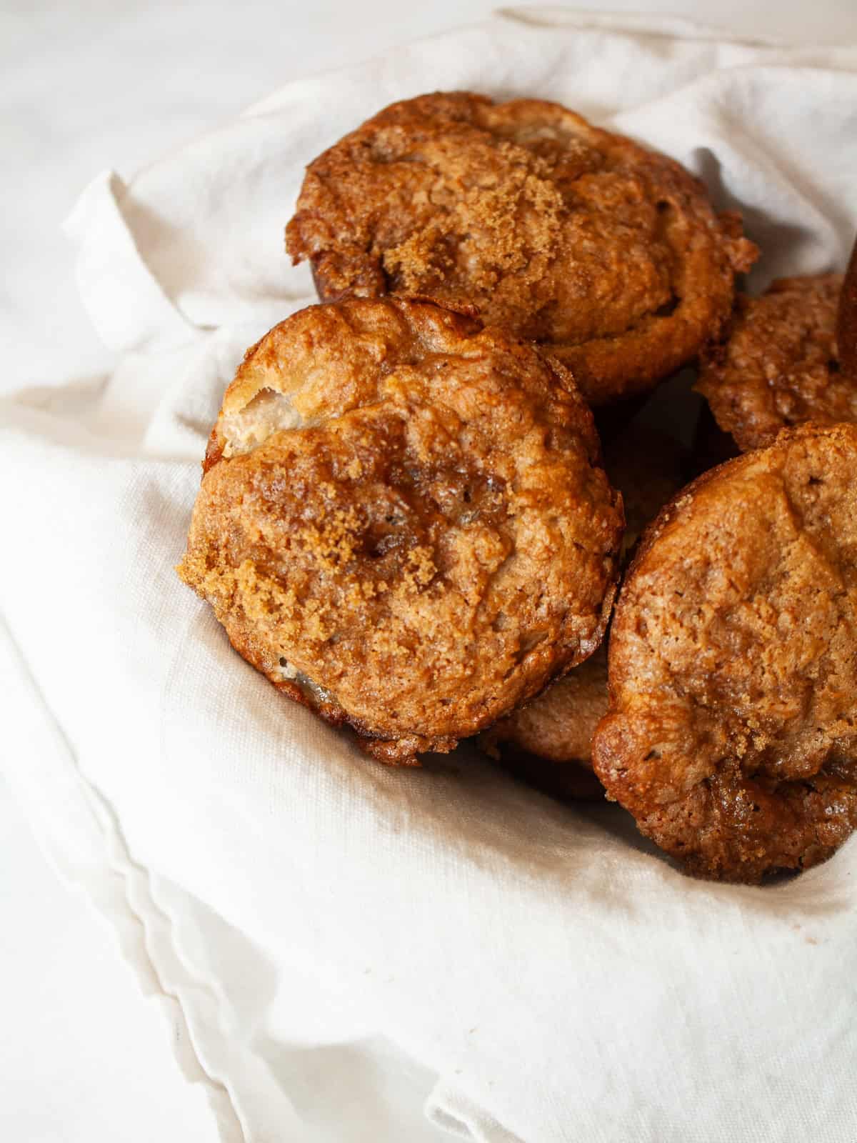 Brown sugar topping is shown on pear muffins.