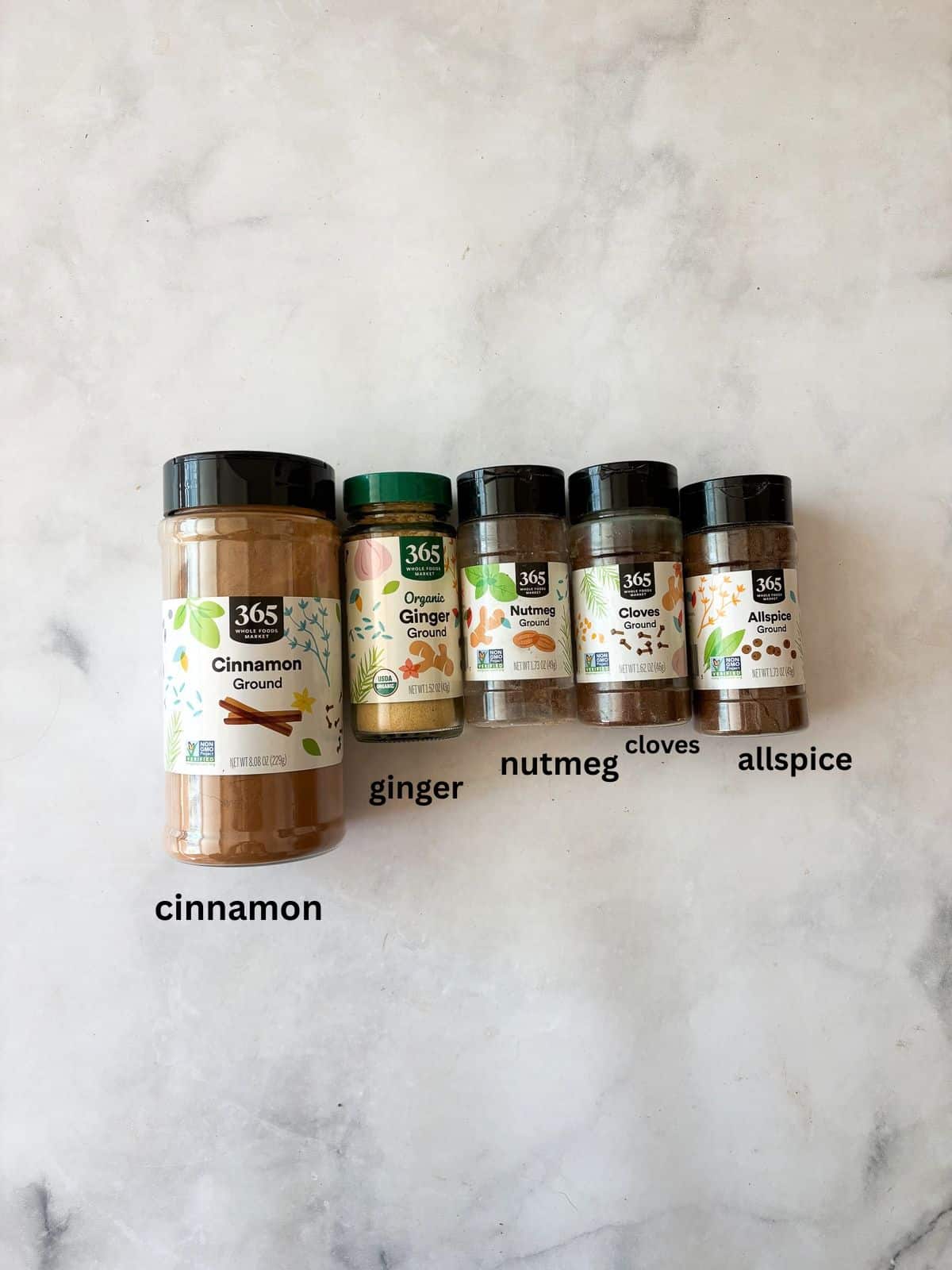 A homemade, versatile pumpkin spice blend with cinnamon, nutmeg, ginger, cloves, and allspice. Great in pies, muffins, quick breads, and more! Ingredients for pumpkin spice blend are text-labeled.