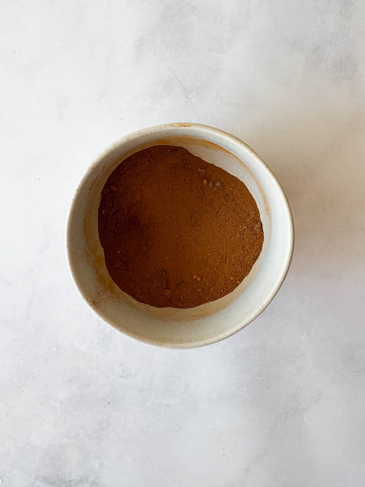 Make easy homemade apple pie spice with cinnamon, nutmeg, ginger, allspice, cloves, and cardamom. Perfect for fall baking! Apple pie spice mix after being whisked together.
