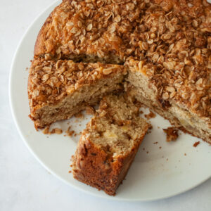 Slices of apple crumb cake on a serving plate.