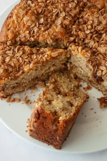 Slices of apple crumb cake on a serving plate.