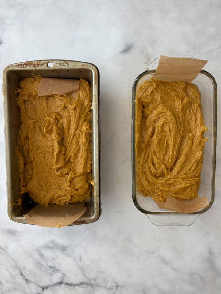 This gluten-free olive oil pumpkin bread is rich, moist, and full of fall spices. Made with oat and almond flours, it's easy to customize! Olive oil pumpkin bread batter in 2 loaf pans.